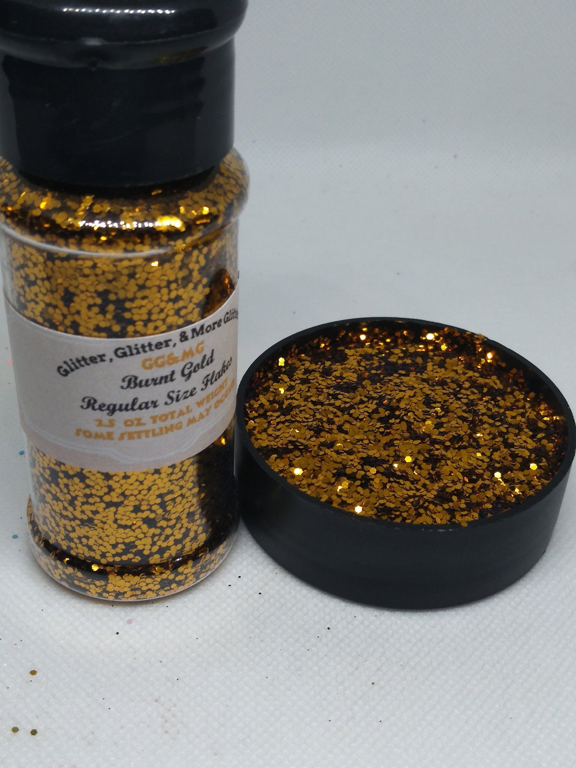 Burnt Gold – Regular size gold glitter flakes with a touch of orange tint.