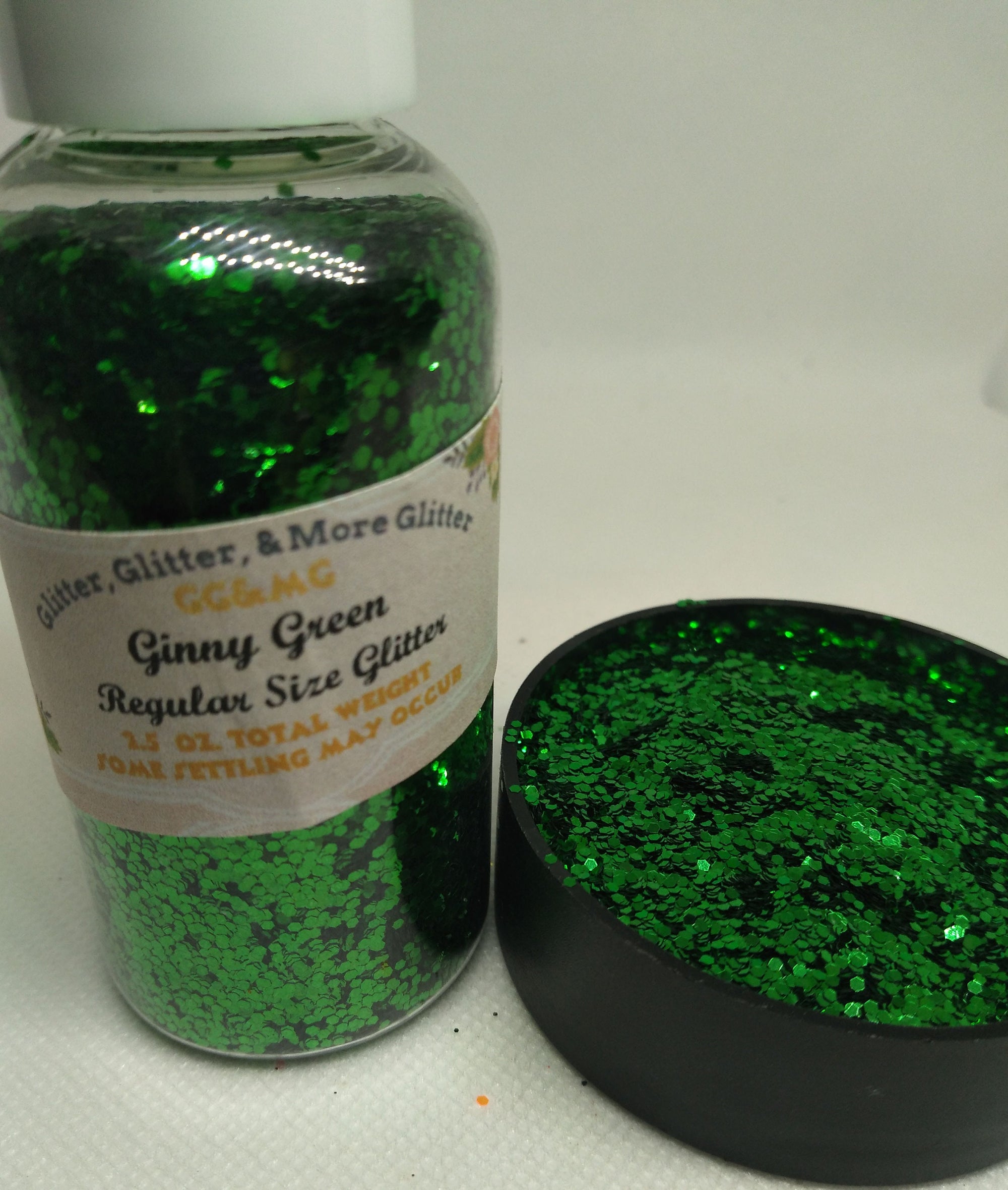 Ginny Green – Regular size green glitter flakes.